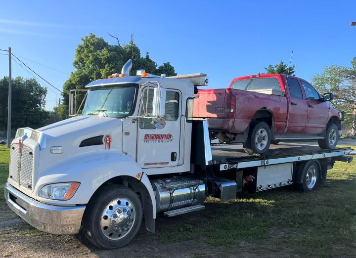 Diversified Towing Flatbed Tow Truck with Red Truck