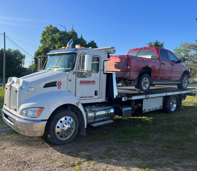 Flatbed Tow Truck with red pickup ruck