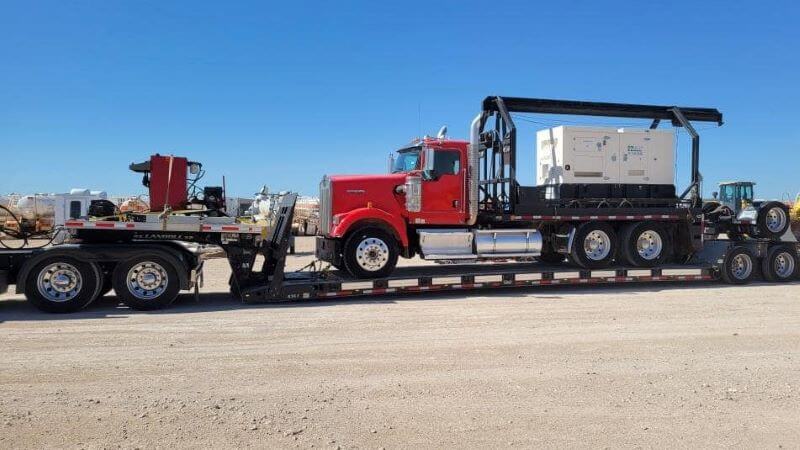 Trailer hauling truck hauling equipment