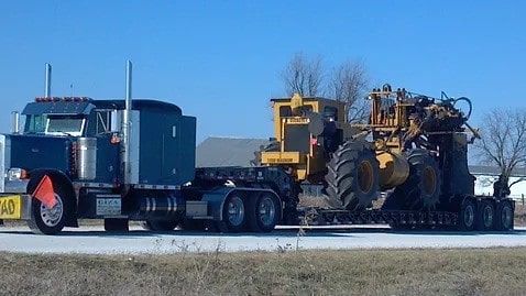 Hauling construction equipment on a trailer