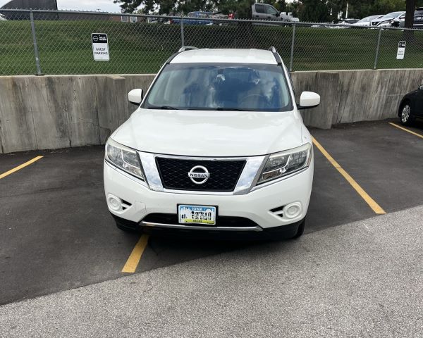 White car parked outside the lines