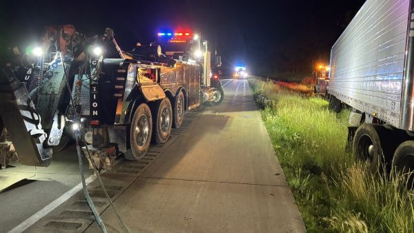 Heavy Duty Tow Truck and Trailer in Ditch