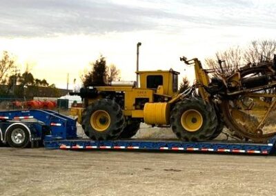 Construction equipment on a long trailer