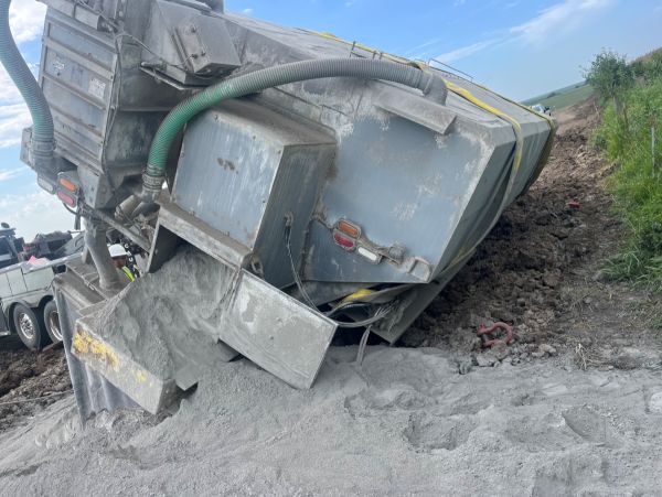 piece of machinery spilling concrete mix