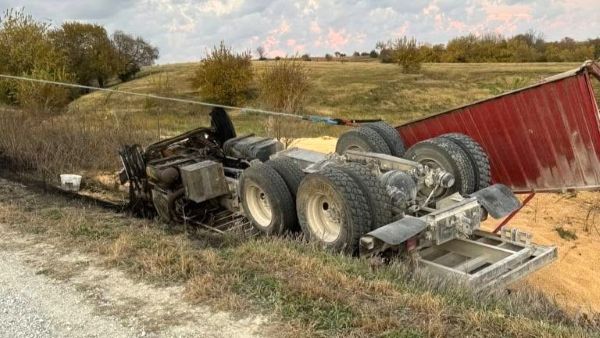 Grain truck upside down in ditch
