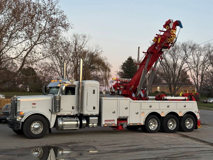 White rotator tow truck with red crane