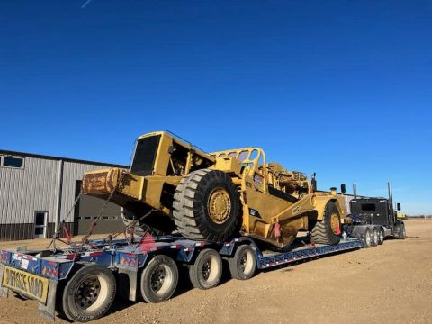 Hauling Construction Equipment Large yell road or construction equipment
