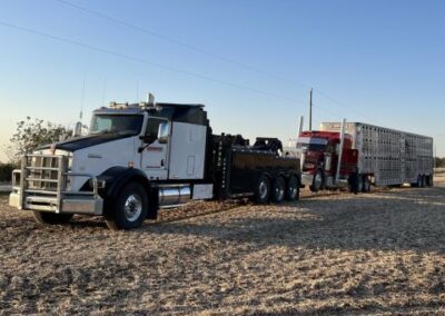 Truck and hog trailer being towed