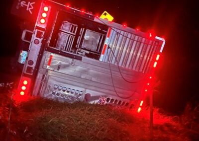 Trailer on its side with lights on