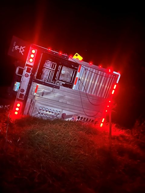 Recovery of Semi Trailer on its side Trailer on its side with lights on