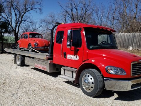 VW Bug on Flatbed Red VW Bug on red flatbed tow truck