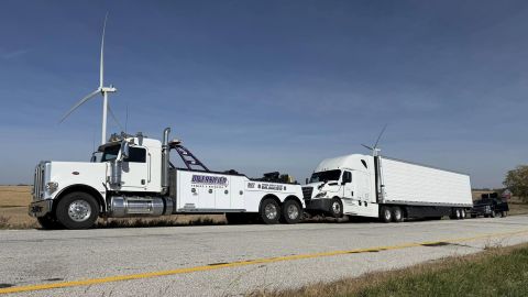 50-Ton Tow Truck Towing White Semi Tractor Trailer Heavy Duty tow truck towing semi