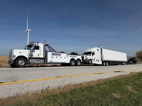 Heavy Duty tow truck towing semi